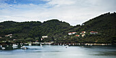 A Village And Harbour On A Greek Island; Panormos, Skiathos, Greece