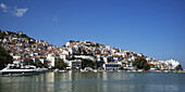 Houses In A Village And Boats In A Harbour Of A Greek Island; Panormos, Thessalia Sterea Ellada, Greece