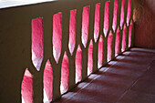 Light And Shadow Through A Mexican Pink Painted Stucco Wall; Ixtapa, Mexico