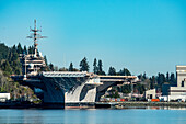 Looking straight on the bow of the USS Nimitz Air Craft Carrier moored in the Bremerton Shipyard.  USS Nimitz is a supercarrier of the United States Navy, and the lead ship of her class. One of the largest warships in the world; Bremerton, Washington, United States of America