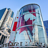 Red maple leaf art installation on sign; Vancouver, British Columbia, Canada