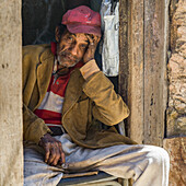 Portrait of a senior Cuban man with a cigar; Havana, Cuba