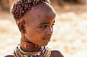 Hamer girl at a bull jumping ceremony, which initiates a boy into manhood, in the village of Asile; Omo Valley, Ethiopia
