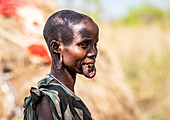 Mursi woman  in a village in Mago National Park, Omo Valley; Southern Nations Nationalities and Peoples' Region, Ethiopia