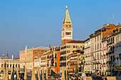Campanile bell tower and Renaissance architectural style palace buildings along the Riva degli Schiavoni promenade, San Marco; Venice, Veneto, Italy