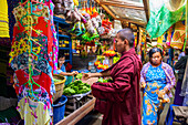 Monk shopping at a market; Bagan, Myanmar