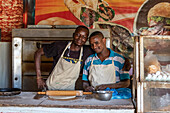 Cooks preparing a pizza; Ed Damer, Northern State, Sudan