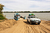 Four-wheel drive Toyota Land Cruiser exiting a ferry over the River Nile; Kokka, Northern State, Sudan