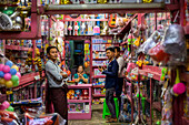 Vendors and shoppers in a toy shop; Yawngshwe, Shan State, Myanmar