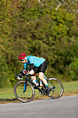 Cyclist riding on a road, near Trace Nachez Bridge; Franklin, Tennessee, United States of America