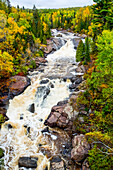 Beaver River cascading through a landscape of autumn colours; Minnesota, United States of America