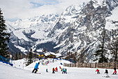 Skiers at an alpine resort, Italian side of Mont Blanc; Courmayeur, Aosta Valley, Italy