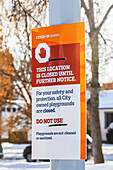 City sign of playground closure during Covid-19 world pandemic; Edmonton, Alberta, Canada