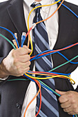 Close-up of Businessman Holding CAT5 Cables