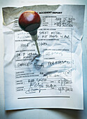 Accident Report Pinned to Wall with Awl