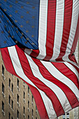 American Flag flapping in Wind, 6th Avenue, Manhattan, New York, USA
