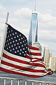 American Flag with One World Trade Center in Background, New York City, New York, USA