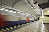 View of London Underground Platform at Edgware Road with Train Leaving, London, England, UK