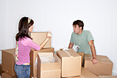 Couple Arguing over Packing Boxes