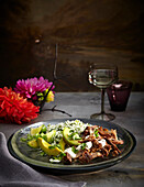 Pork carnitas with herb rice on plate, Mexican Fiesta, studio shot