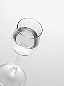 Glass of Grappa on White Background, Studio Shot