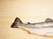 Close-up of Tail of Salmon Trout on Cutting Board, Studio Shot