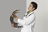 Veterinarian Holding Alligator