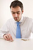 Man Counting Coins