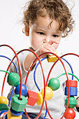 Little Girl Playing With Toy