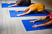 Women in Yoga Class Doing Child Pose