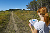 Hiker Looking at Map