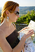 Woman Reading Map, Cortona, Province of Arezzo, Tuscany, Italy