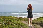 Backview of Woman Hiking and Looking at View, Ilha do Mel, Parana, Brazil