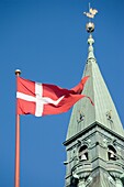 Copenhagen, Denmark; Danish Flag Flying On Town Hall