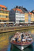 Nyhavn Canal, Copenhagen, Denmark; Tour Boat On A Canal