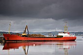 Scotland; Freighter In Harbor