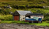 Scotland; Boat Docked By Boathouse