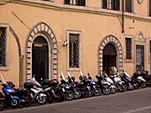 Motorcycles Parked In Front Of Old Building; Rome, Italy