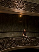 Young Woman Standingon Staircase In Vatican Museum; Vatican, Rome, Italy