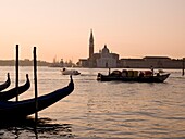 Gondolas And Boats On Canal, Church Of St. Giorgio Maggiore In Background; Grand Canal, Venice, Italy