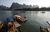 Li River, Yangshuo, China; People In Traditional Chinese Boats