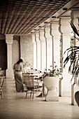 Waitress Setting Table In Restaurant, Toned Image