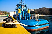 Santa Cruz Port, Huatulco, Oaxaca State, Mexico; Mexican Navy Tugboat Moored By Dock