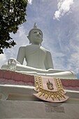 Low Angle View Of Buddha And Temple; Phra Buddhasurintaramongkol, Isan, Thailand