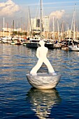 White Statue Floating Near Busy Marina