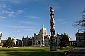 Totem Pole Standing By British Columbia Parliament Building
