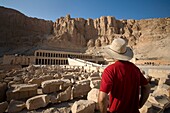 Man Looking At The Temple Of Hatshepsut; Luxor,Egypt