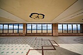 Large Room With Windows And Stone Floor