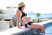 Woman Relaxing By Pool, Cabo San Lucas, Mexico