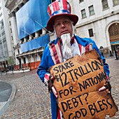 Street Performer Begging On Wall Street, New York Stock Exchange, Manhattan, New York, Usa